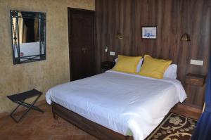 A bed or beds in a room at Gite Nadia