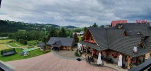an aerial view of a large house with a patio at Dom Wypoczynkowy U Chramca in Białka Tatrzanska