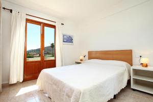 A bed or beds in a room at Villa Animeta