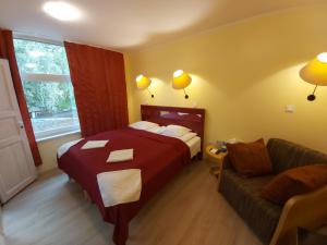 Tempat tidur dalam kamar di Viva Nord Hotel