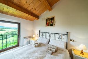 A bed or beds in a room at Agriturismo Podere Coldifico