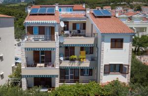 a group of houses with solar panels on their roofs at Apartments Bašković in Promajna