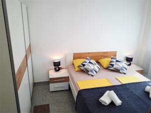 Ein Bett oder Betten in einem Zimmer der Unterkunft A.B.Kvarner