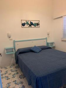 Postel nebo postele na pokoji v ubytování Villetta dei Limoni