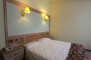 Postel nebo postele na pokoji v ubytování Park Hotel