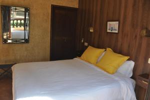 A bed or beds in a room at Gite Nadia