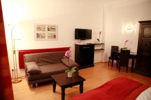 A television and/or entertainment centre at La Scala Apartments