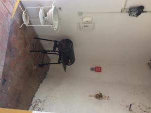 a room with a toilet in a brick wall at Cerro da Janela Hostel in Alte