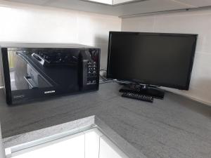 TV a/nebo společenská místnost v ubytování CASA CONTE