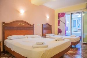 Katil atau katil-katil dalam bilik di Hotel Astoria