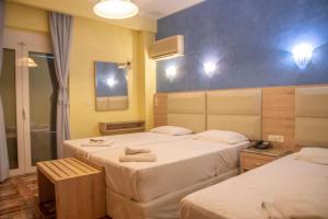 Katil atau katil-katil dalam bilik di Hotel Astoria
