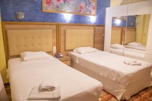 Katil atau katil-katil dalam bilik di Hotel Astoria
