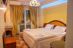 Katil atau katil-katil dalam bilik di Hotel Astoria