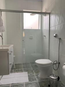 Um banheiro em Hotel E Turismo São Simão