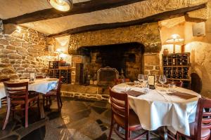 
a dining room with a bar and wine cellar at Auberge De Kerveoc'h in Douarnenez

