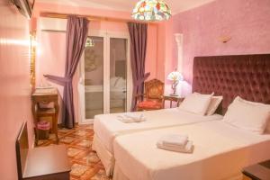 Katil atau katil-katil dalam bilik di Hotel Astoria