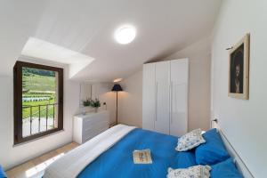 A bed or beds in a room at Agriturismo Podere Coldifico
