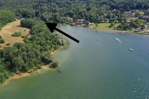 an aerial view of a river with boats in the water at Chata Domaša - Monika in Holčíkovce +2 photos