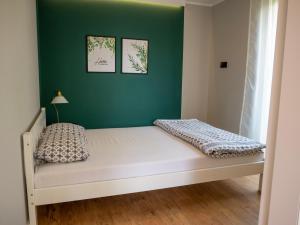 Posteľ alebo postele v izbe v ubytovaní Różany Domek