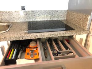 a drawer in a kitchen with a counter top at Apartamentos casa Tia Antonia in Málaga