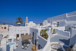 a view of the side of a white building at Radiant Santorini in Mesaria