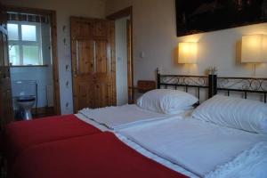 Säng eller sängar i ett rum på Beal alha na Gaoithe