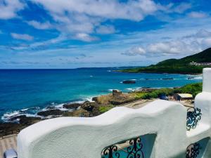 a view of the ocean from a balcony at Seyan Inn in Eluan