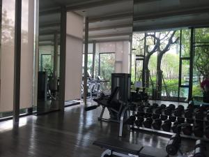 a gym with a bunch of chairs and windows at the base in Udon Thani
