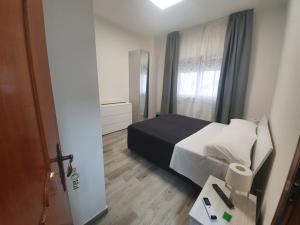 A bed or beds in a room at B&B IONIO