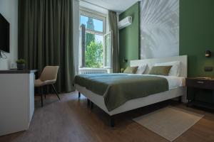 Tempat tidur dalam kamar di Villa Aurum Health & Climatotherapy Center