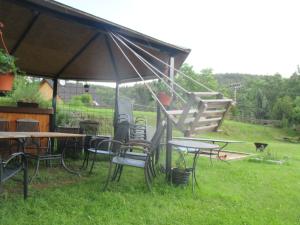 a group of tables and chairs under a tent at Chalupa u Matúšů Jeseníky in Dolní Moravice