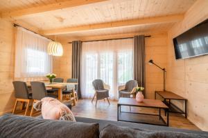 a living room with a couch and a table at Góralski Domek Zornicka in Zakopane