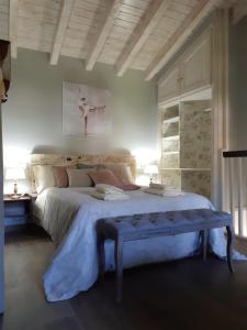 Postel nebo postele na pokoji v ubytování La Vierta Casa Rural Agroturismo