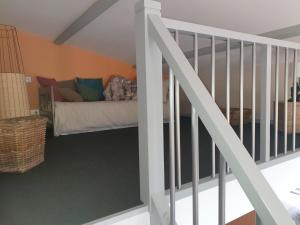 a bedroom with a bed in the corner of a room at L' Albizia in Pintheville