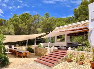 a patio with a set of stairs leading to a house at Can Paredes Ibiza in Ibiza Town