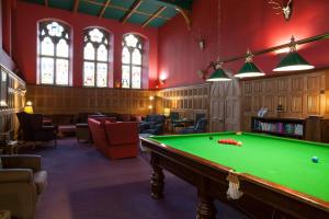 a billiard room with a green pool table at Loch Ness Moat House Apartments in Fort Augustus
