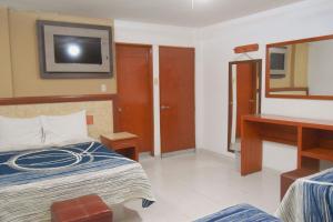 Postel nebo postele na pokoji v ubytování Hotel Niza Zona Piel