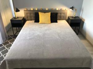 Postel nebo postele na pokoji v ubytování Apartamenty Garden