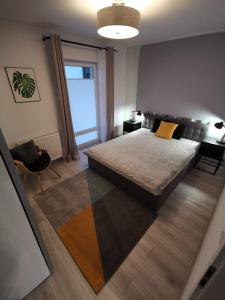 Postel nebo postele na pokoji v ubytování Apartamenty Garden
