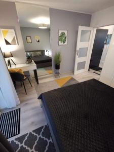 Postel nebo postele na pokoji v ubytování Apartamenty Garden