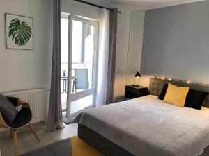 Postel nebo postele na pokoji v ubytování Apartamenty Garden