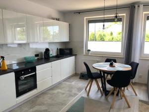 Kuchyň nebo kuchyňský kout v ubytování Apartamenty Garden