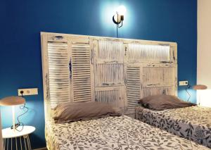 Säng eller sängar i ett rum på Calamilloraptm2