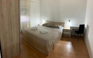 Posteľ alebo postele v izbe v ubytovaní Apartman Bitunjac