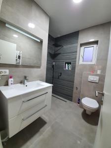 Kúpeľňa v ubytovaní Apartman Bitunjac