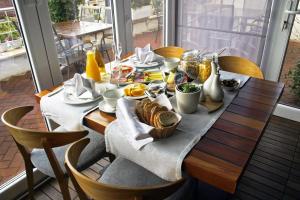 a table with a breakfast of food on it at Apartments Villa Azzurra Bol in Bol