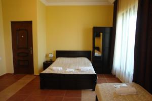 Letto o letti in una camera di Marshal Resort Kobuleti