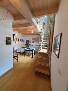 a room with a staircase and a living room at Arco Della Neve Guest House in Bari