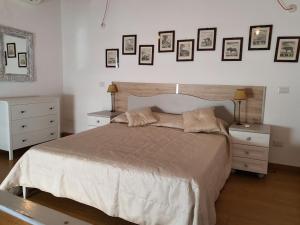 Postel nebo postele na pokoji v ubytování Arco Della Neve Guest House
