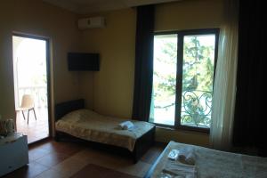 Letto o letti in una camera di Marshal Resort Kobuleti
